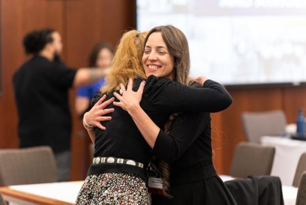 Erin and Lymarie hug