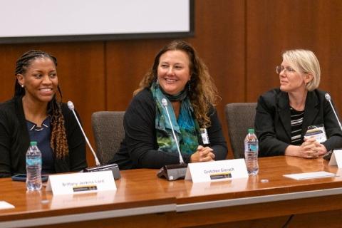 Brittany Lord, Gretchen Gierach, and Jessica Faupel-Badger seated at the moderator's table.